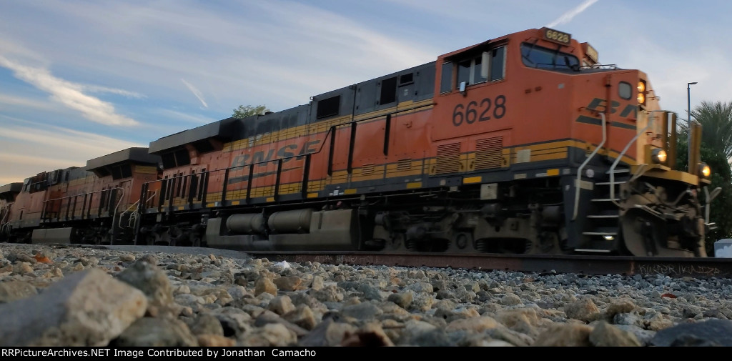 BNSF 6628 leads UP ZAILC through El Monte 